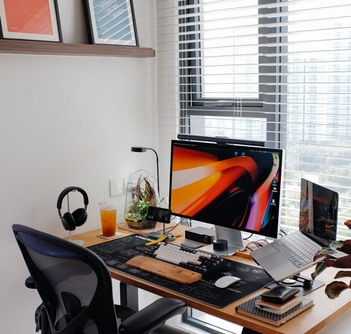 A home office workspace with many tech gadgets