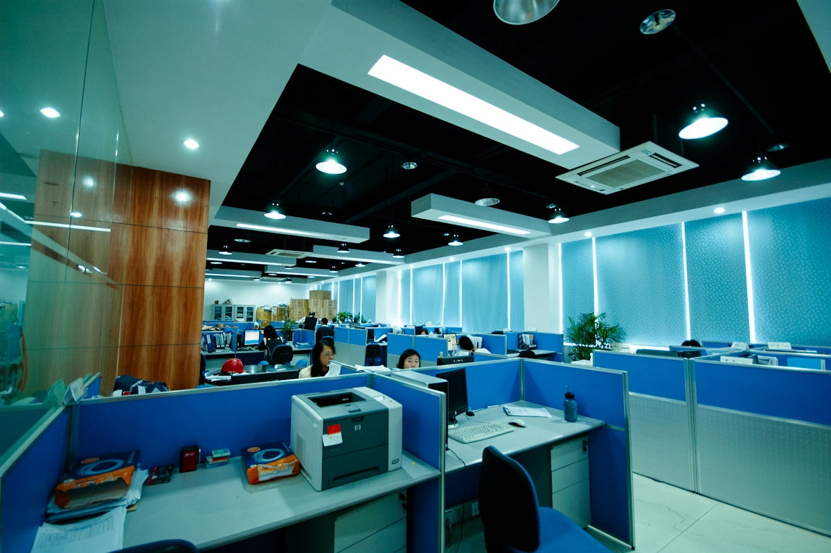 Modern office interior with cubicles and workstations